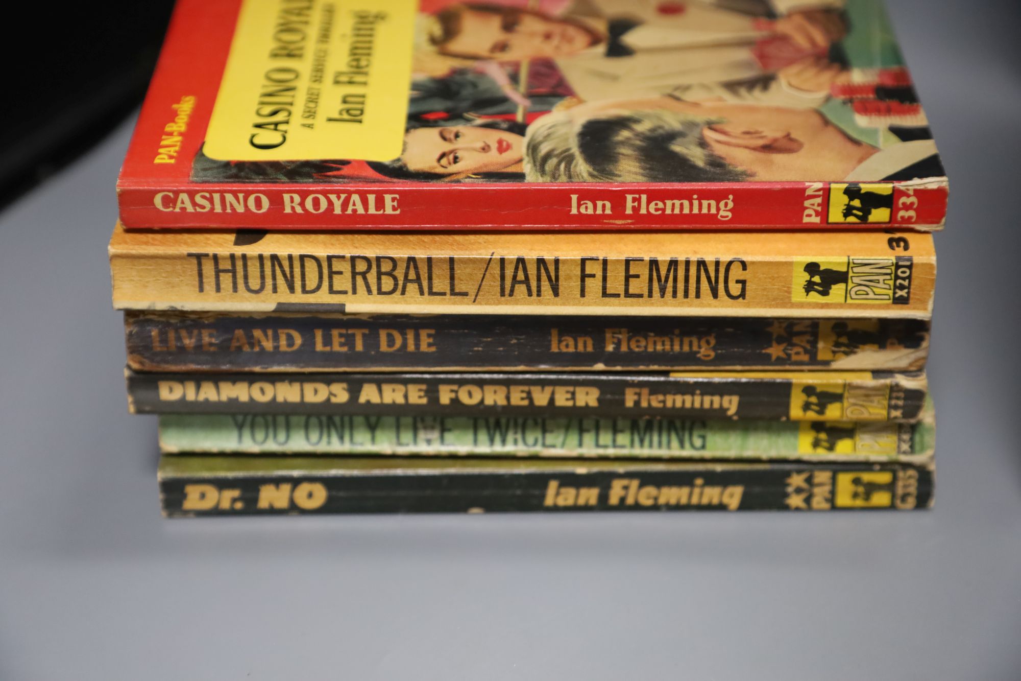 Fleming, Ian. (James Bond). A Collection of Pan Paperbacks, includes Casino Royale, 2nd printing; Thunderball, 1st printing; The Spy